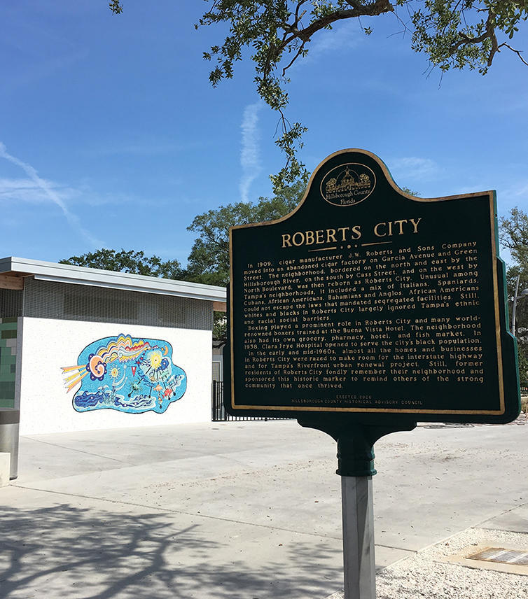 Roberts City historic marker; Background: Jovi Schnell's mosaic