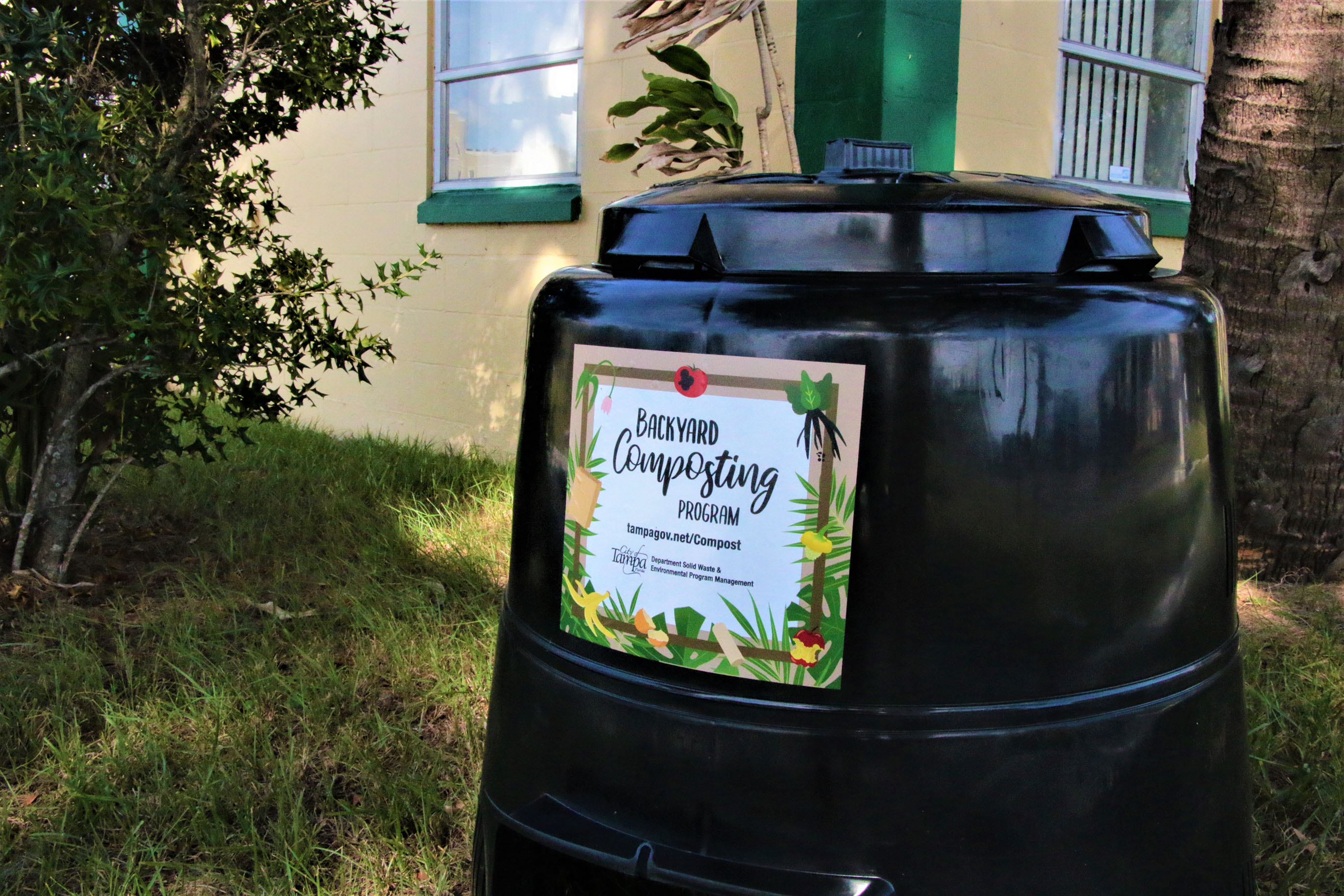 Composting bin next to house