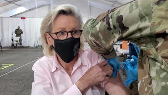 Mayor Castor receiving her first vaccine