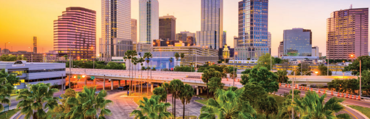 City of Tampa skyline photo at sunset overlooking the Selmon Expressway exit ramp and the Downtown Core.