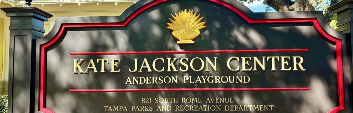 Kate Jackson Center Anderson Playground entrance sign with gold leaf design.