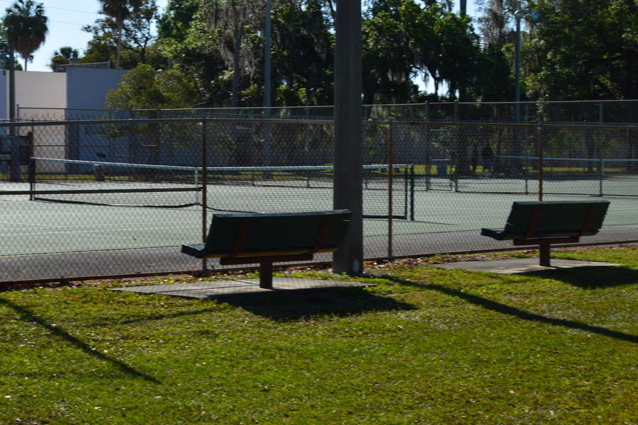 View of tennis court outside of fence