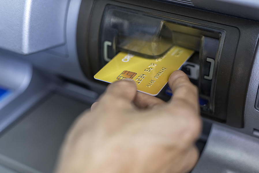 ATM with hand and card