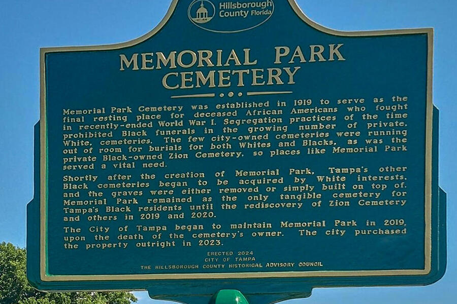 Memorial Park Cemetery historical marker with text and Hillsborough County logo.