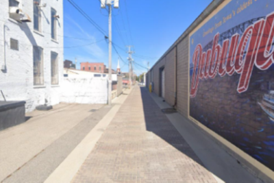 Alleyway with mural in West Tampa, part of neighborhood enrichment planning project.