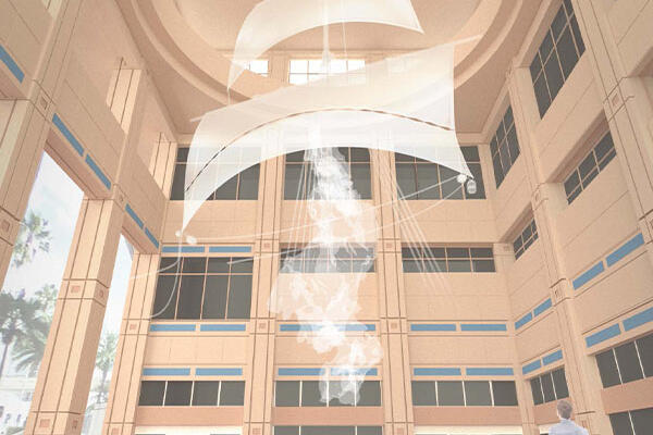 White fabric panels and rising smoke sculpture in a tall, sunlit atrium with people nearby.