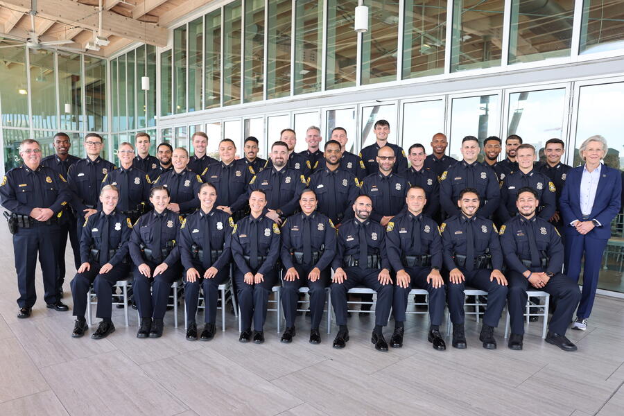Group photo of uniformed officers at a swearing-in ceremony, August 26, 2026.