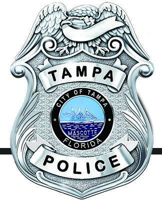 Tampa Police Department logo with blue letters and an emblem.