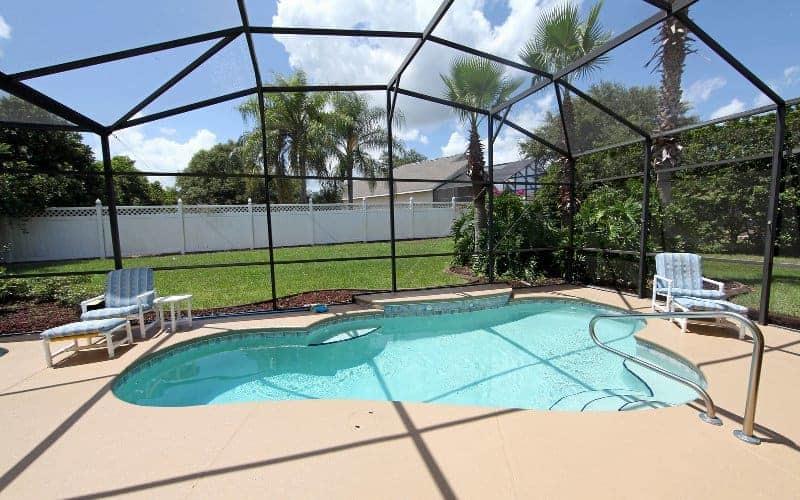 Image depicting a pool screen enclosure on a beautiful sunny day