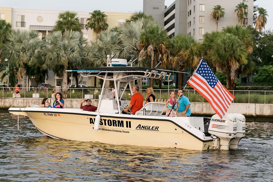 People on Boat on Hillsborough River flying an American Flag