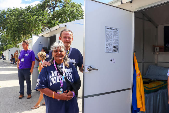 Smiling individuals at Tampa Hope shelter