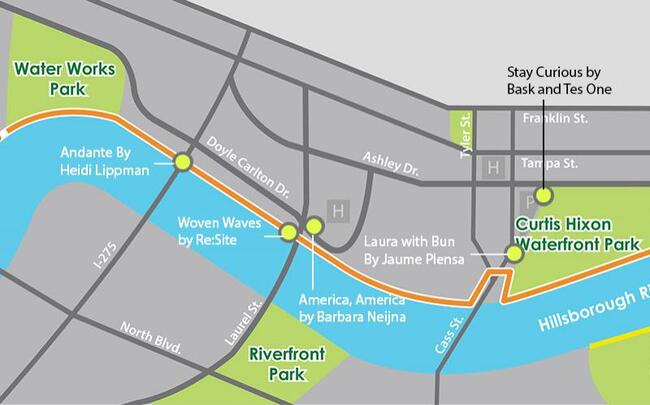 Map highlighting parks and riverwalk in a city area with labeled art installations.