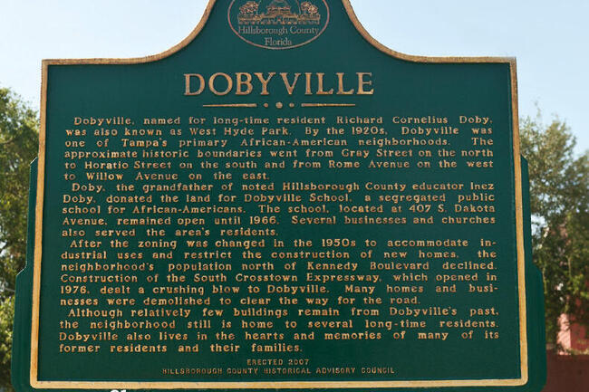 Dobyville historical marker with text about its history and significance.