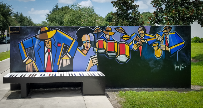 James Vann's mural celebrates East Tampa's rich musical heritage with bold geometric figures and vibrant colors.