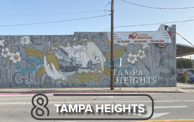Street mural in Tampa Heights with flowers and abstract patterns.