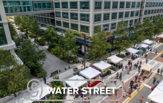 Aerial view of a street market near a building, labeled "9 Water Street."