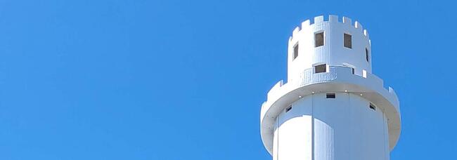 Top of the Sulphur Springs water tower against a clear blue sky