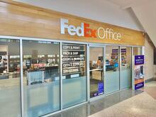 FedEx Office storefront with glass windows and signage.