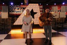 Two auditioners warm up on the practice stage at the America's Got Talent Auditions