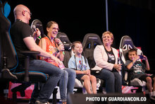 Children and adults laughing during a GuardianCon panel discussion