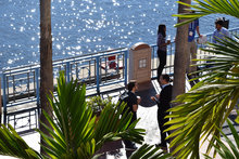 View of the Tampa Riverwalk from the Tampa Convention Center shows conference attendees enjoying the waterfront views