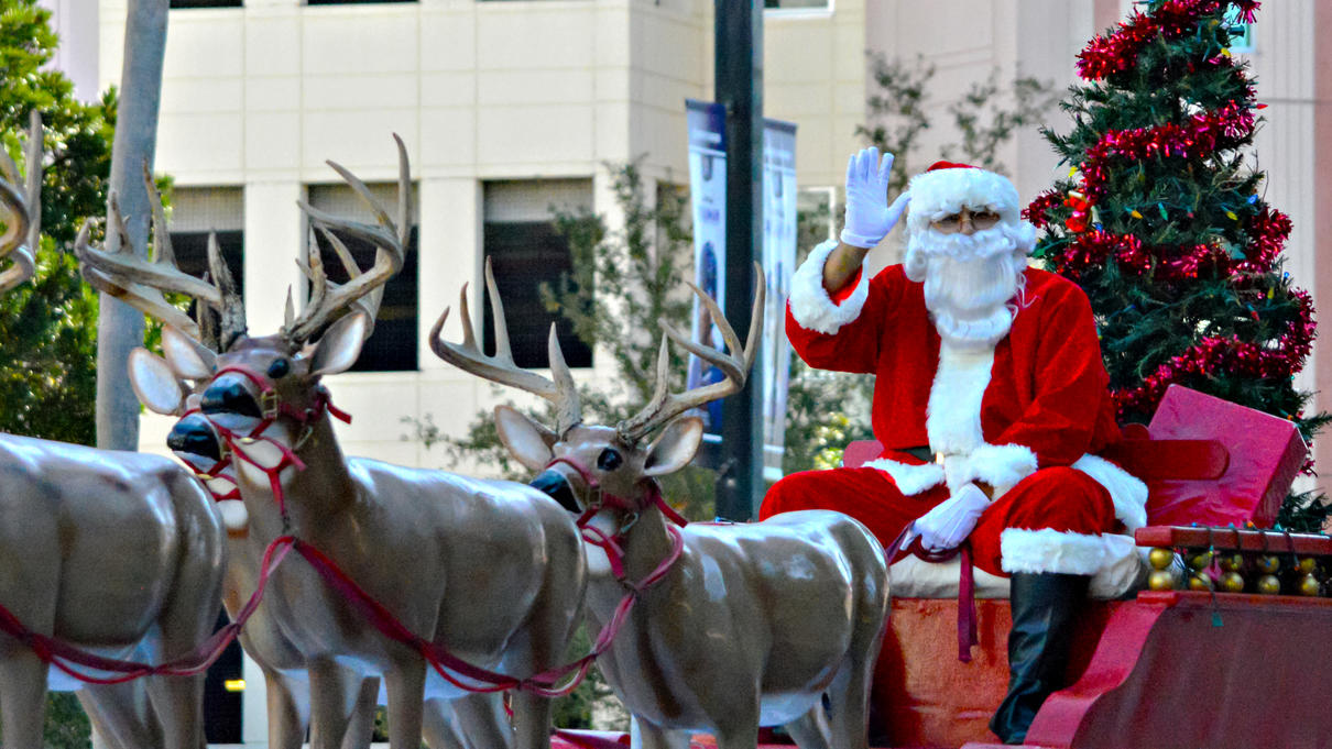 Santa and sleigh being pulled by reindeer