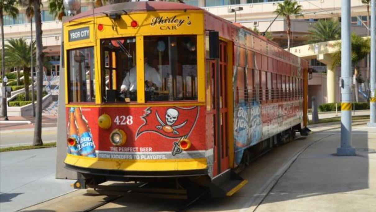 Red and yellow streetcar with Tampa Bay Buccaneers logo