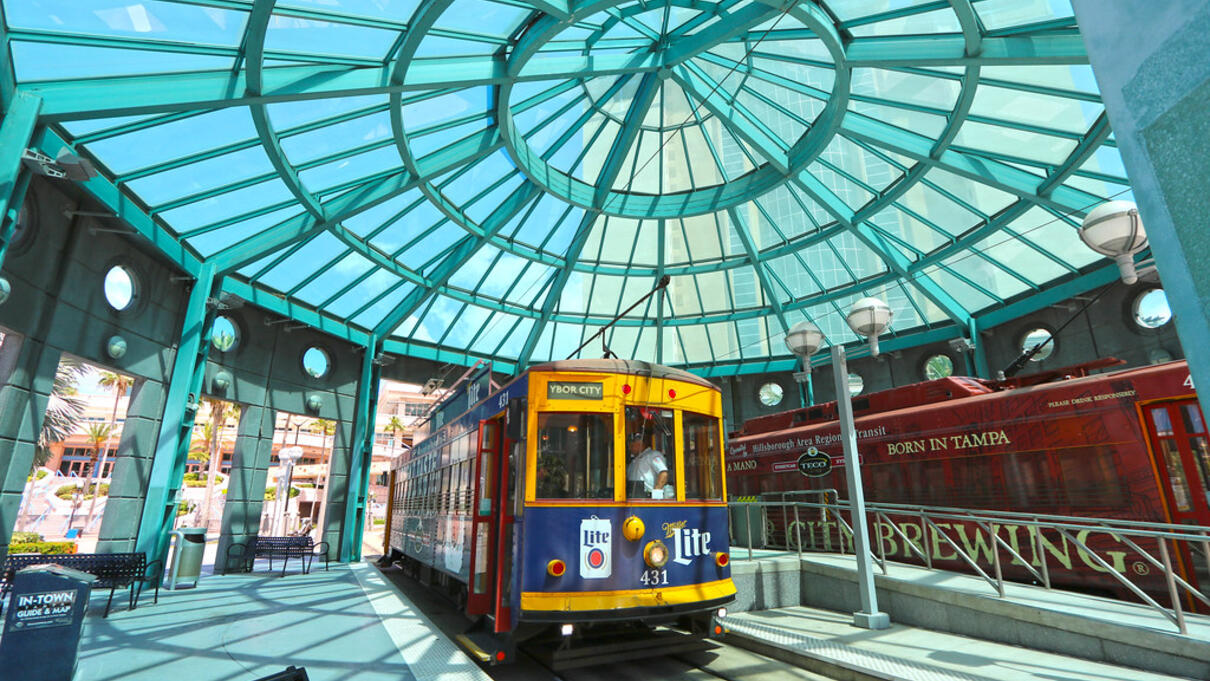 Streetcar under a glass dome at Dick Greco Plaza Station.