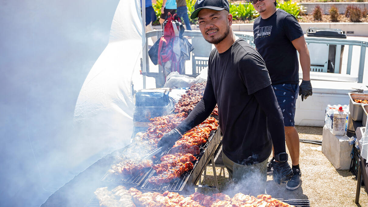 Grilling skewers at Tampa Asian Pacific Islander Cultural Festival