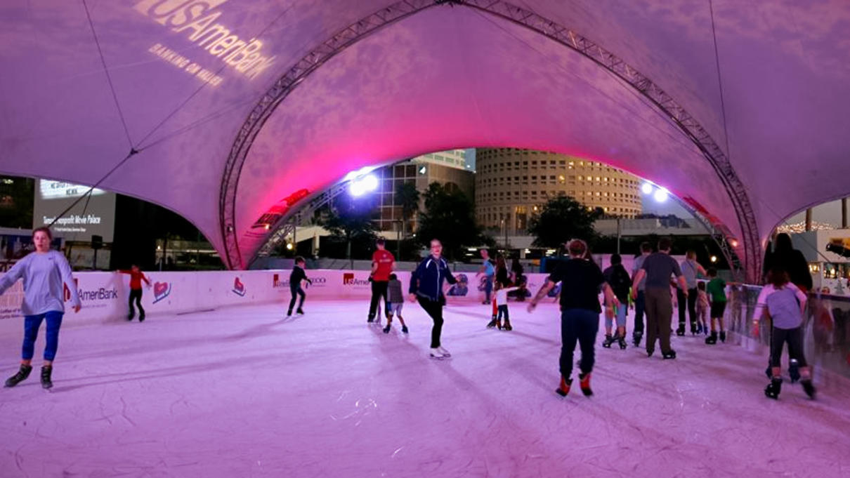 People skating on ice rink